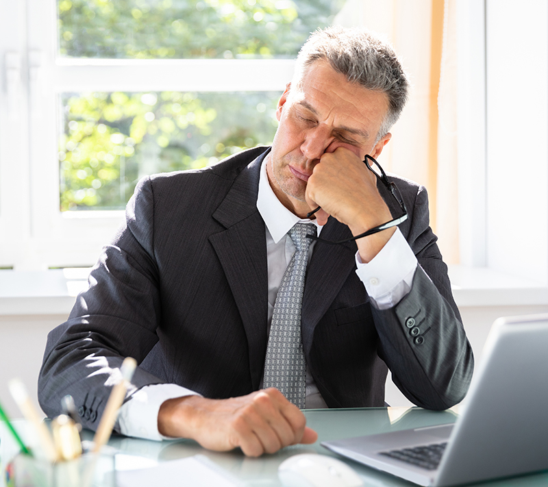 Businessman Sleeping In Office